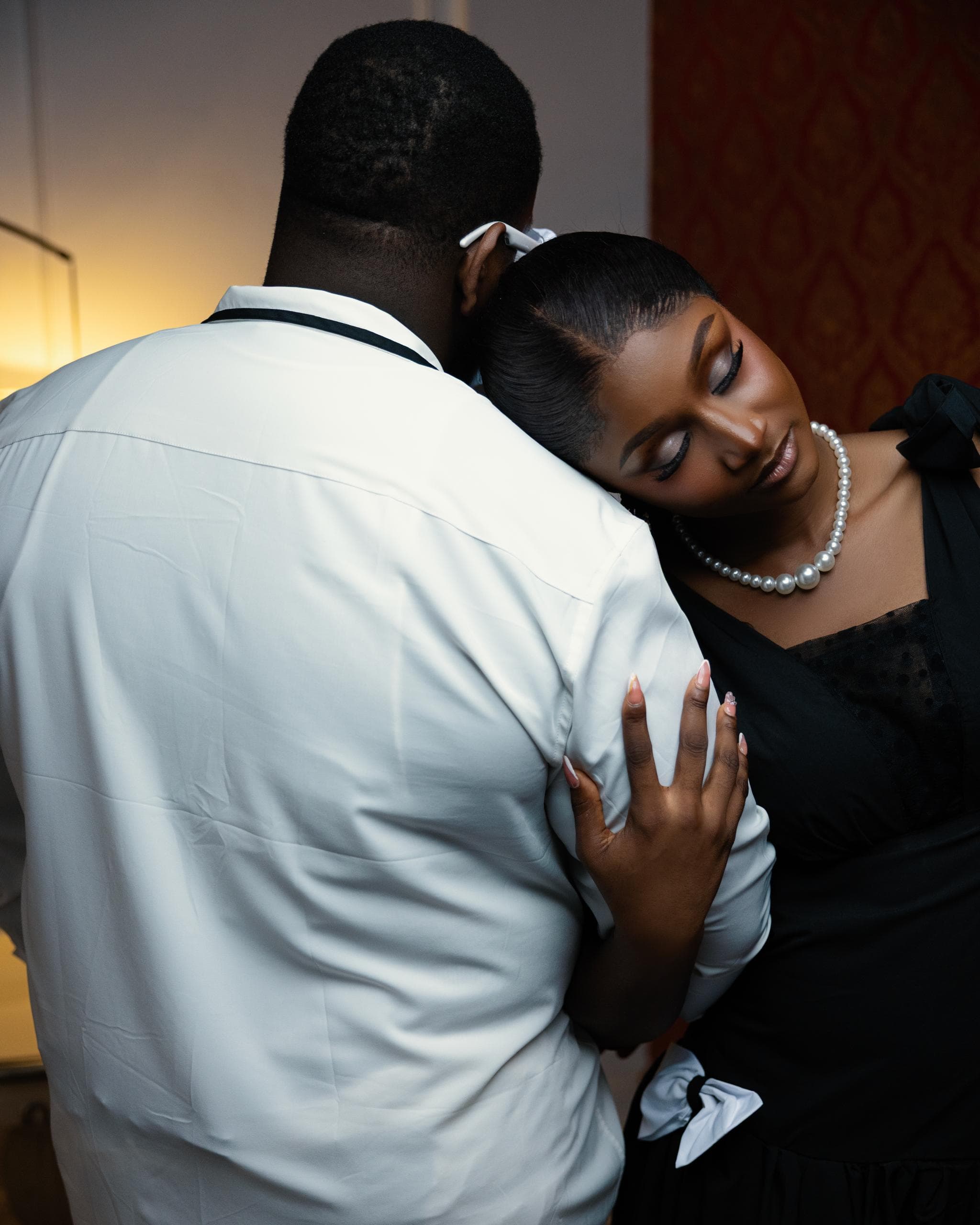 Gabrielle resting her head on Ifeanyi's shoulder