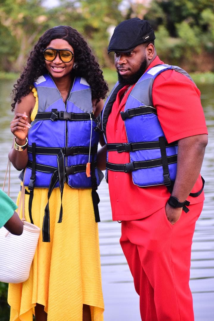 Gabrielle and Ifeanyi smiling by the water