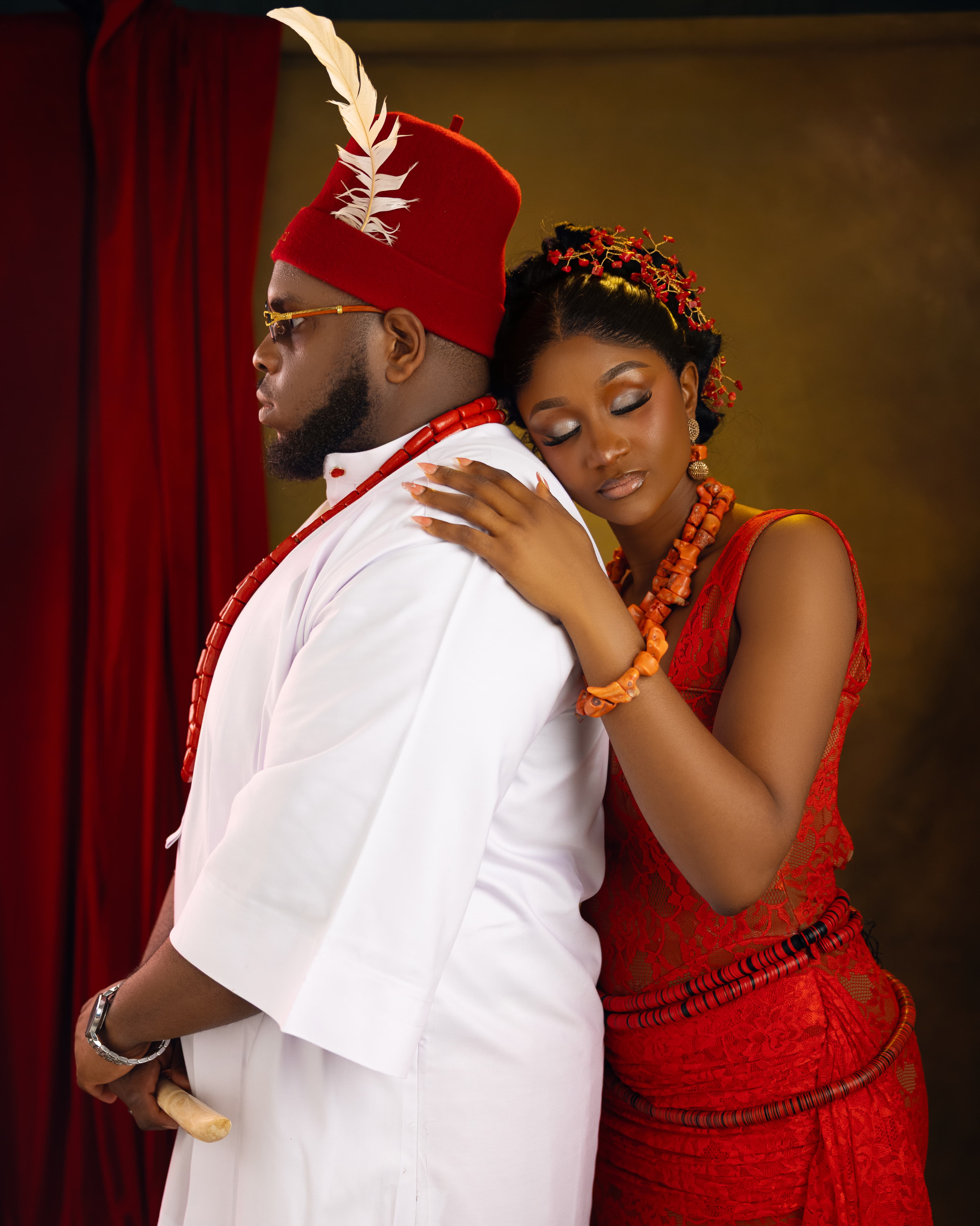 Gabrielle embracing Ifeanyi in traditional attire