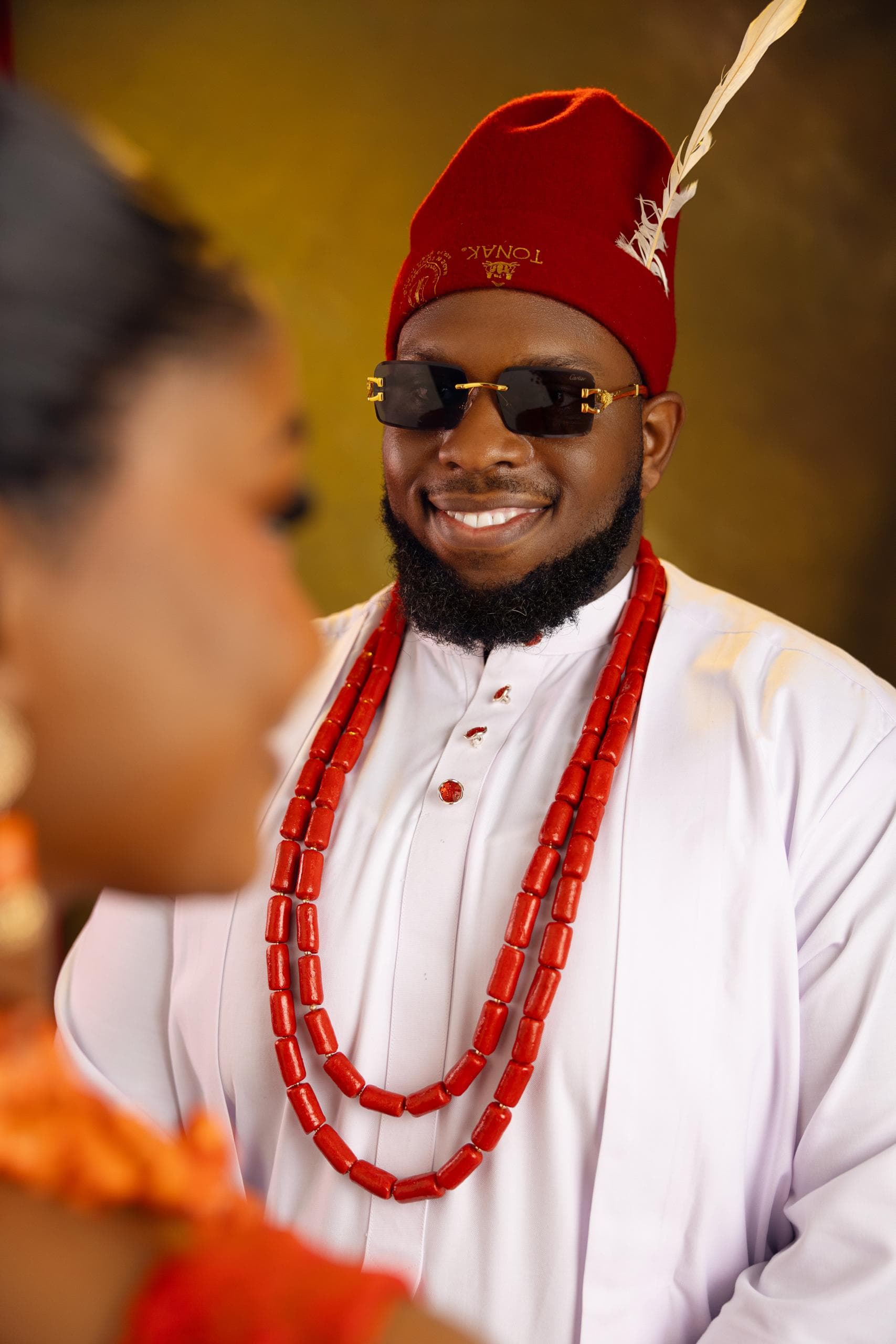 Portrait of Ifeanyi in white traditional attire